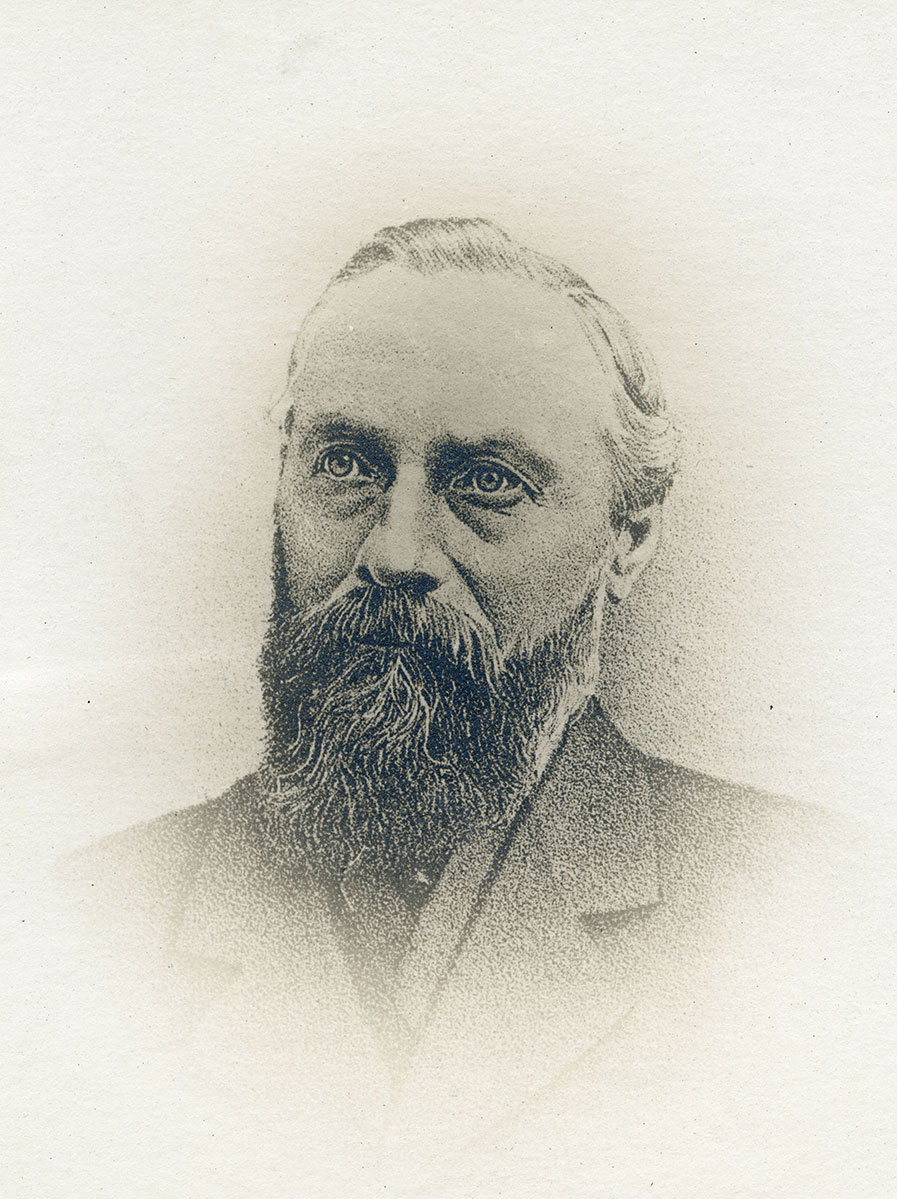 Historic image of an adult white male from the 1800s wearing a formal jacket and shirt.