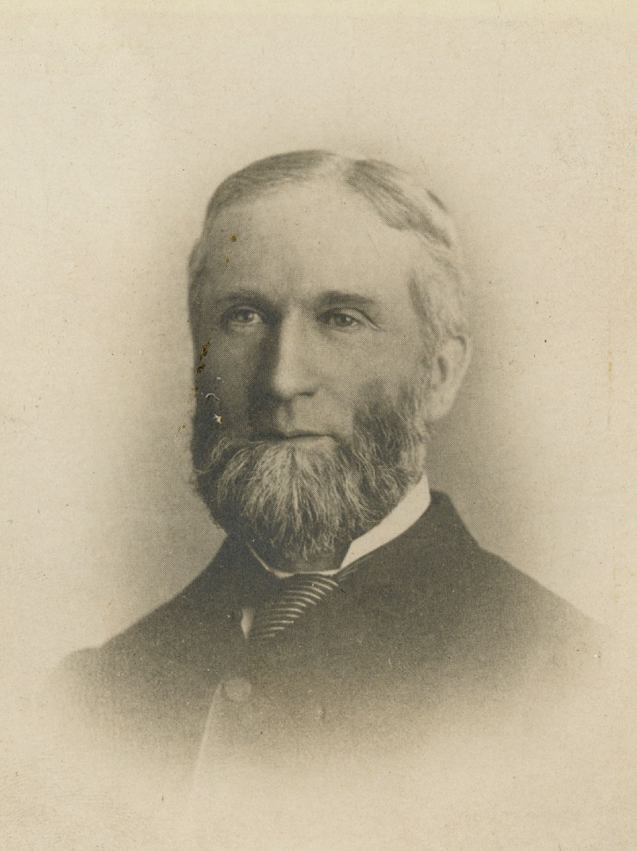 Historic image of an adult white male from the 1800s wearing a formal jacket and shirt.