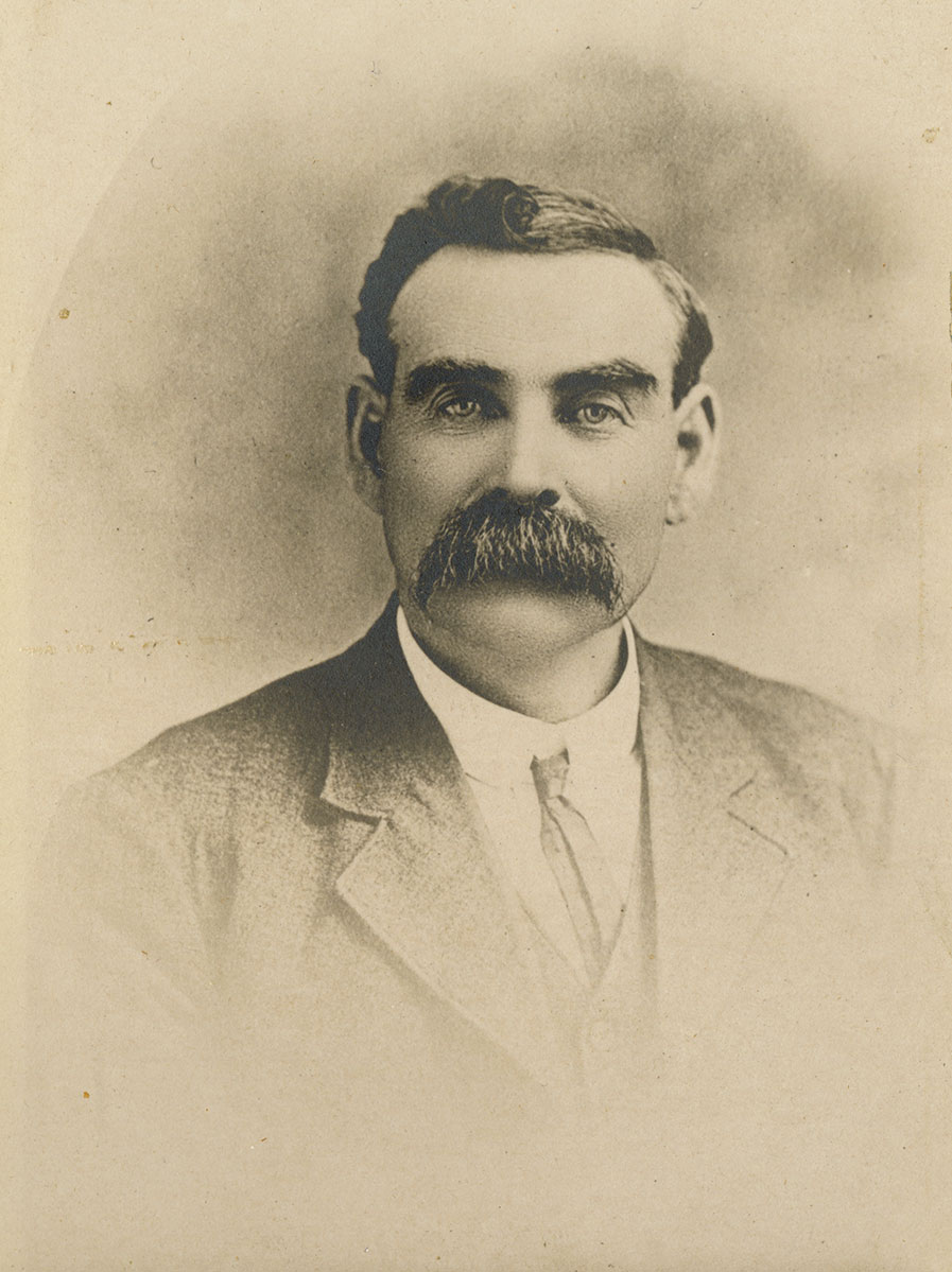 Peter McCallum Historic image of an adult white male from the 1800s wearing a formal jacket and shirt.