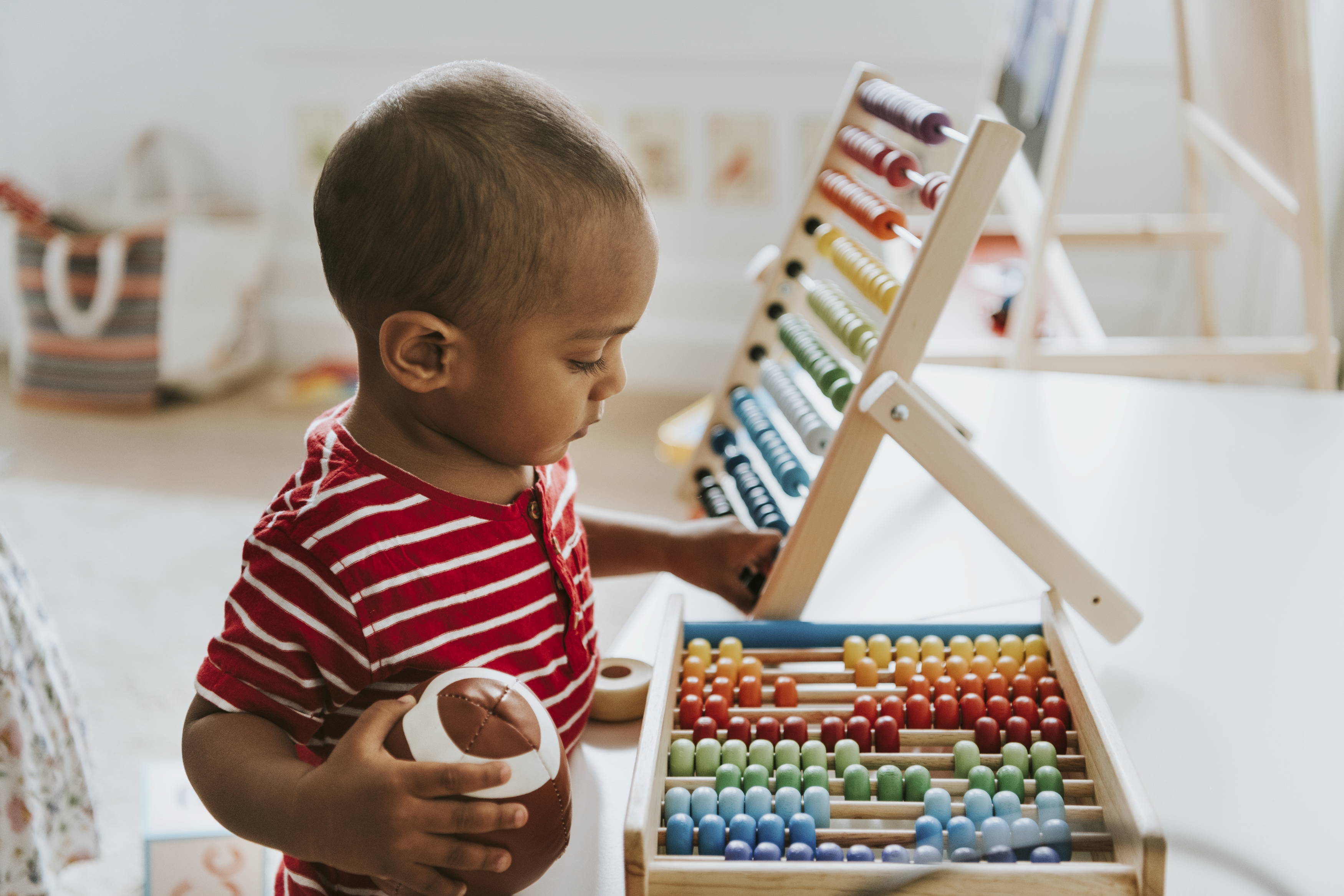 Child playing with abacus