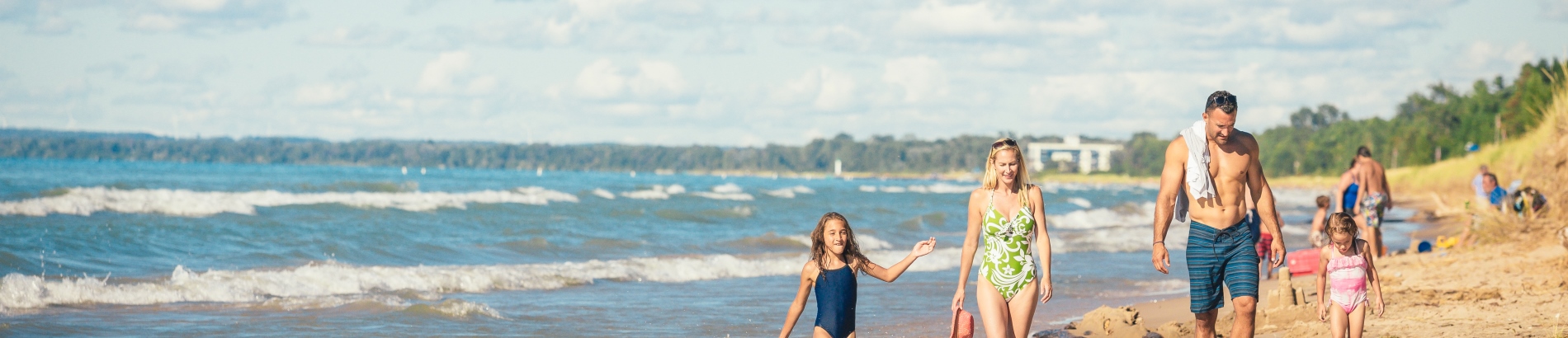 Family walking along Pinery Provincial Park beach