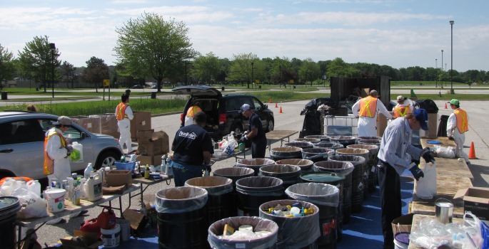 Residents dropping off items at mobile household hazardous waste depot