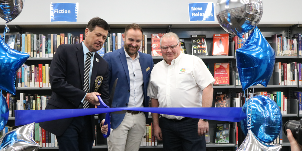 Lambton County Warden Kevin Marriott, County of Lambton General Manager of Cultural Services Andrew Meyer, and Lambton Shores Mayor Bill Weber cut the ceremonial ribbon at the re-opening celebration for the Forest Library on Tuesday, May 3.
