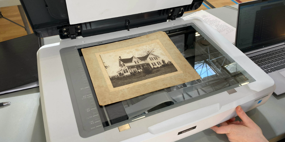 Lambton County Archives staff scan community documents during a Show & Tell event in 2024