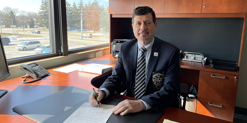 Lambton County Warden Kevin Marriott signs Emergency Declaration Termination papers