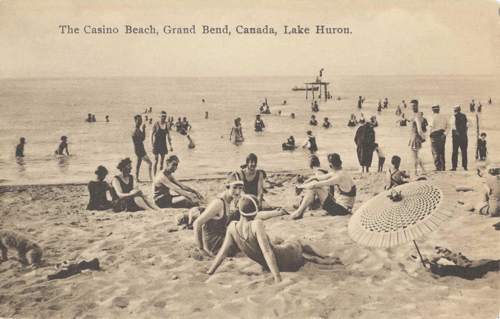 People enjoying time at the Grand Bend Beach in about 1920.