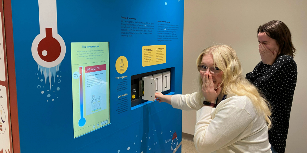 Staff try out an interactive display in A Taste of Science that invites visitors to identify foods ‘forgotten’ in the fridge by scent.