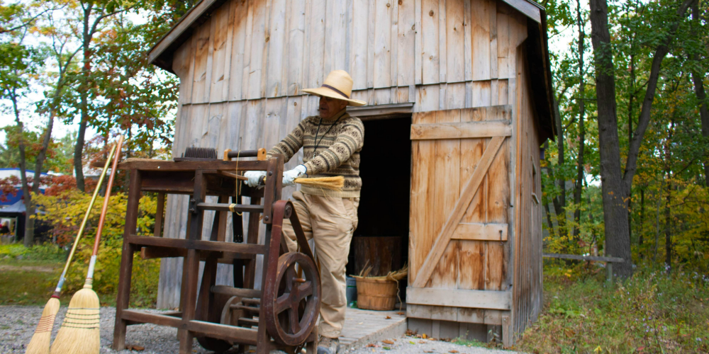 Lambton Heritage Museum staff performing a broom-making demonstration in October 2022