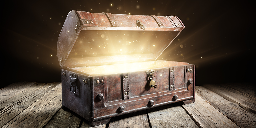 treasure chest opening with a beam of light and sparkles