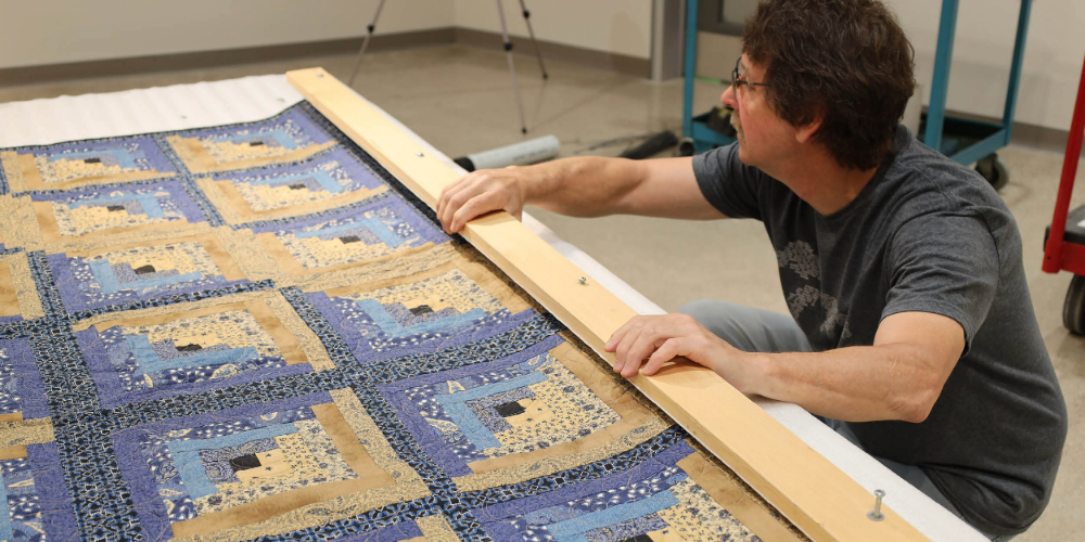 Lambton Heritage Museum prepares quilts for hanging in the 2025 North Lambton Quilters' Guild Quilt Show