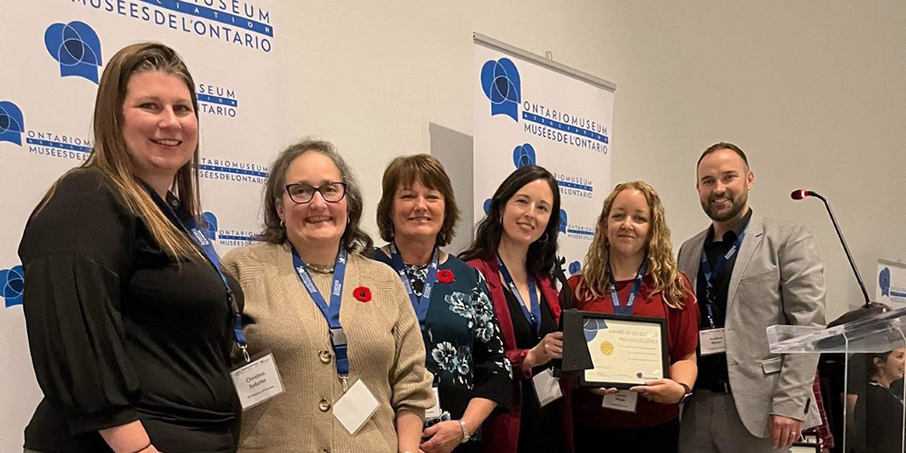 Staff from the Oil Museum of Canada, National Historic Site accept the Award of Excellence in Exhibitions at the OMA Conference. Left to right: Christina Sydorko, Deanna Bullard, Donna Barnes, Erin Dee-Richard, Laurie Webb, Andrew Meyer.