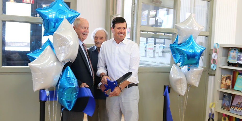 Mayor Brad Loosely, Former Chief Librarian Ronald Baker, Warden Kevin Marriot cut the ribbon at Petrolia Library's reopening celebration