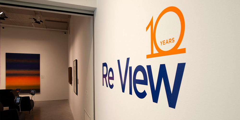 ReView 10 Years sign on wall outside exhibition space