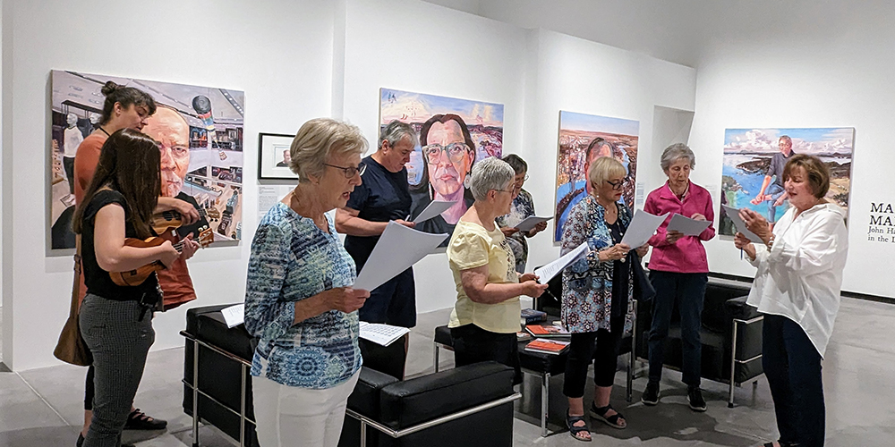 Docents provide a singing tour of an exhibit in the Judith & Norman Alix Art Gallery