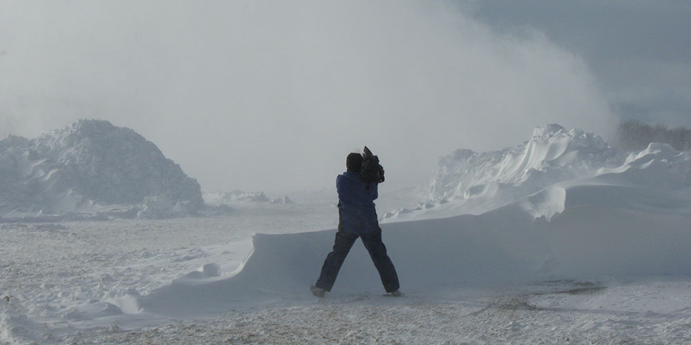 Cameraman recording snowstorm