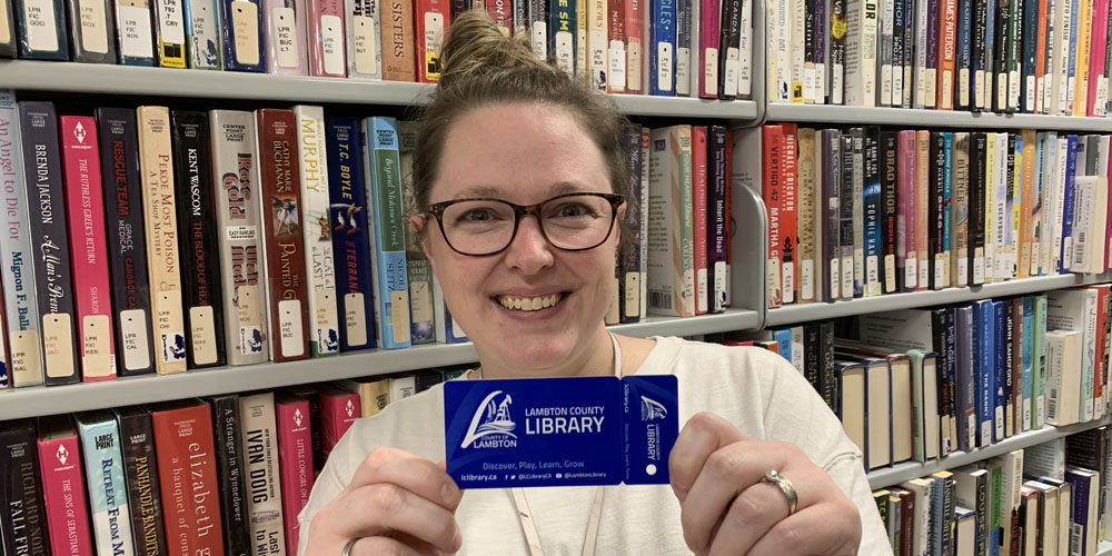 Staff at Lambton County Library show off newly designed library cards