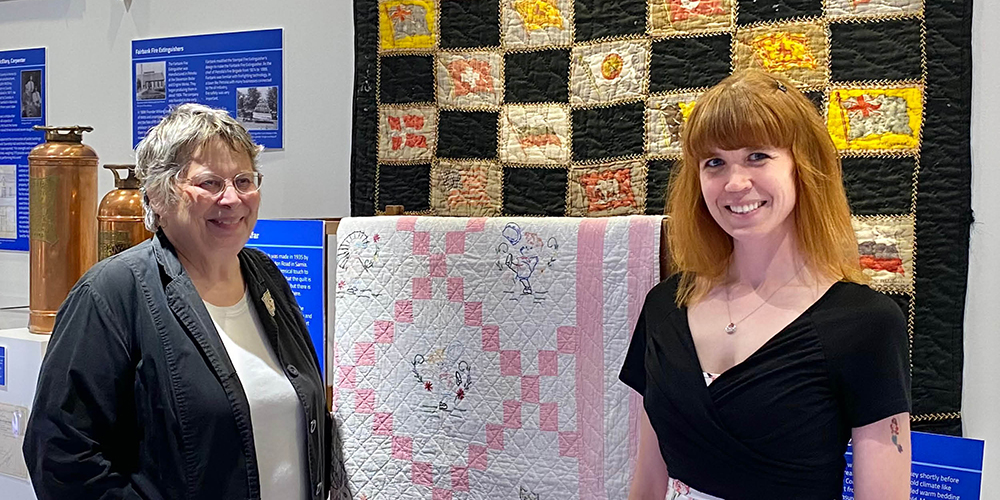 Guild Member Susan Hewett and Curator/Supervisor Dana Thorne with two quilts from Lambton Heritage Museum’s collection currently on display in the Museum’s new permanent exhibit.