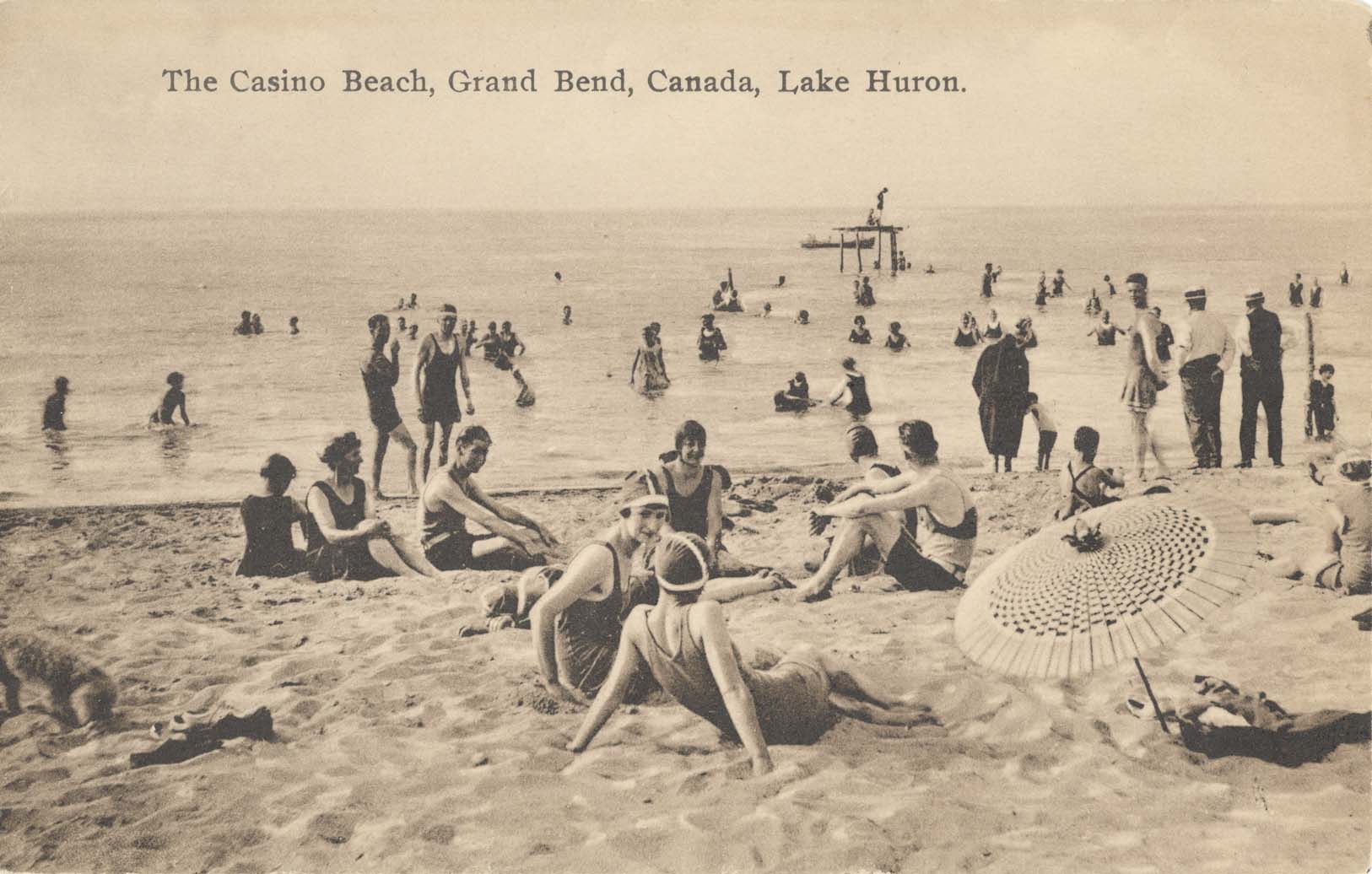 People enjoying the beach in the year 1920