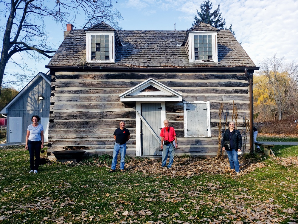 Volunteers standing in front of the Canatara Cabin at Canatara Park