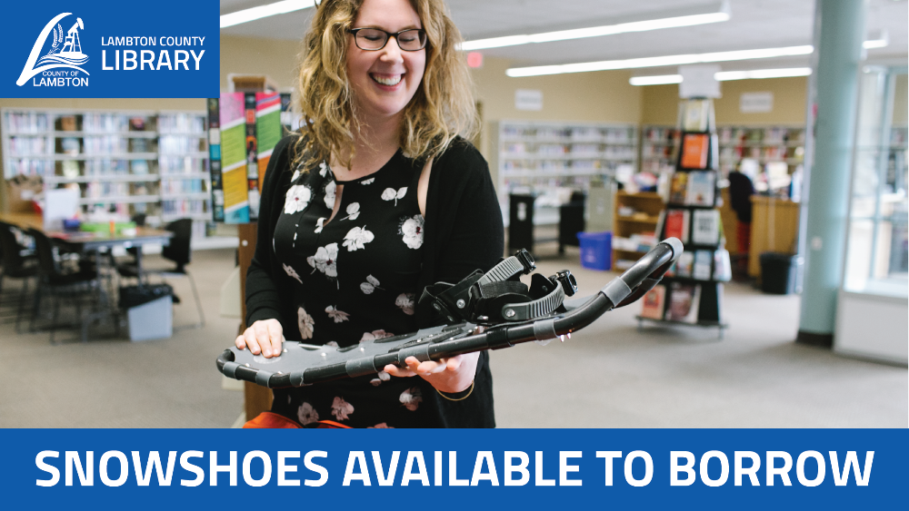 Library staff member holding pair of snowshoes