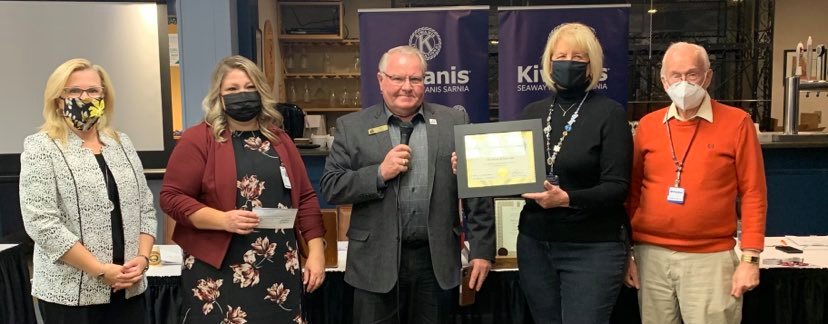 Lambton Circles staff and Warden Weber presenting donor recognition plaque to Seaway Kiwanis members