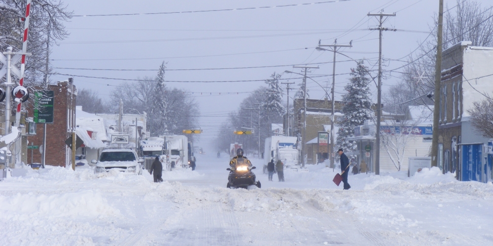 Snowmobile driving on Main Street in Wyoming during the 2010 snow emergency