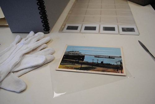 Photograph with gloves and preservation tools on table