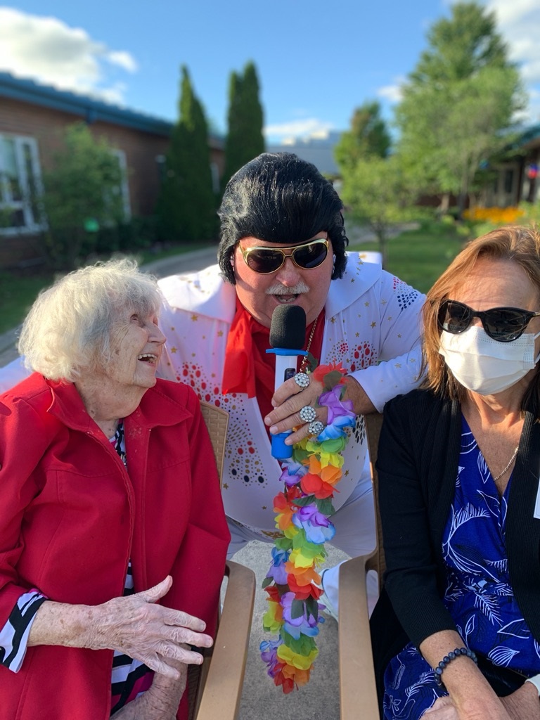 "Elvis" serenades two people attending the North Lambton Lodge barbeque