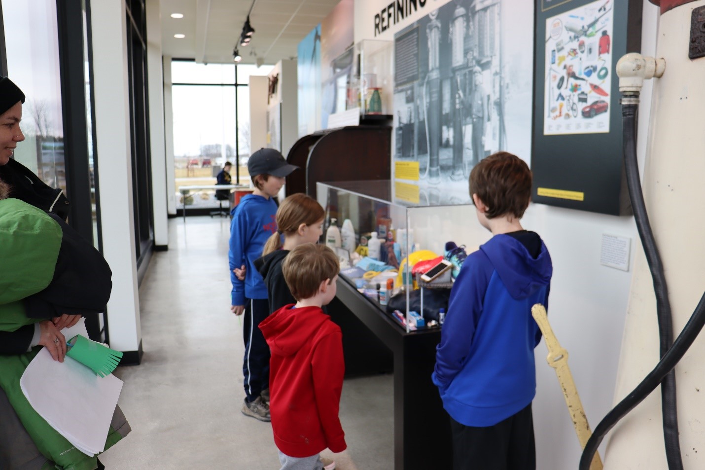 group of children exploring gallery space at Oil Museum of Canada