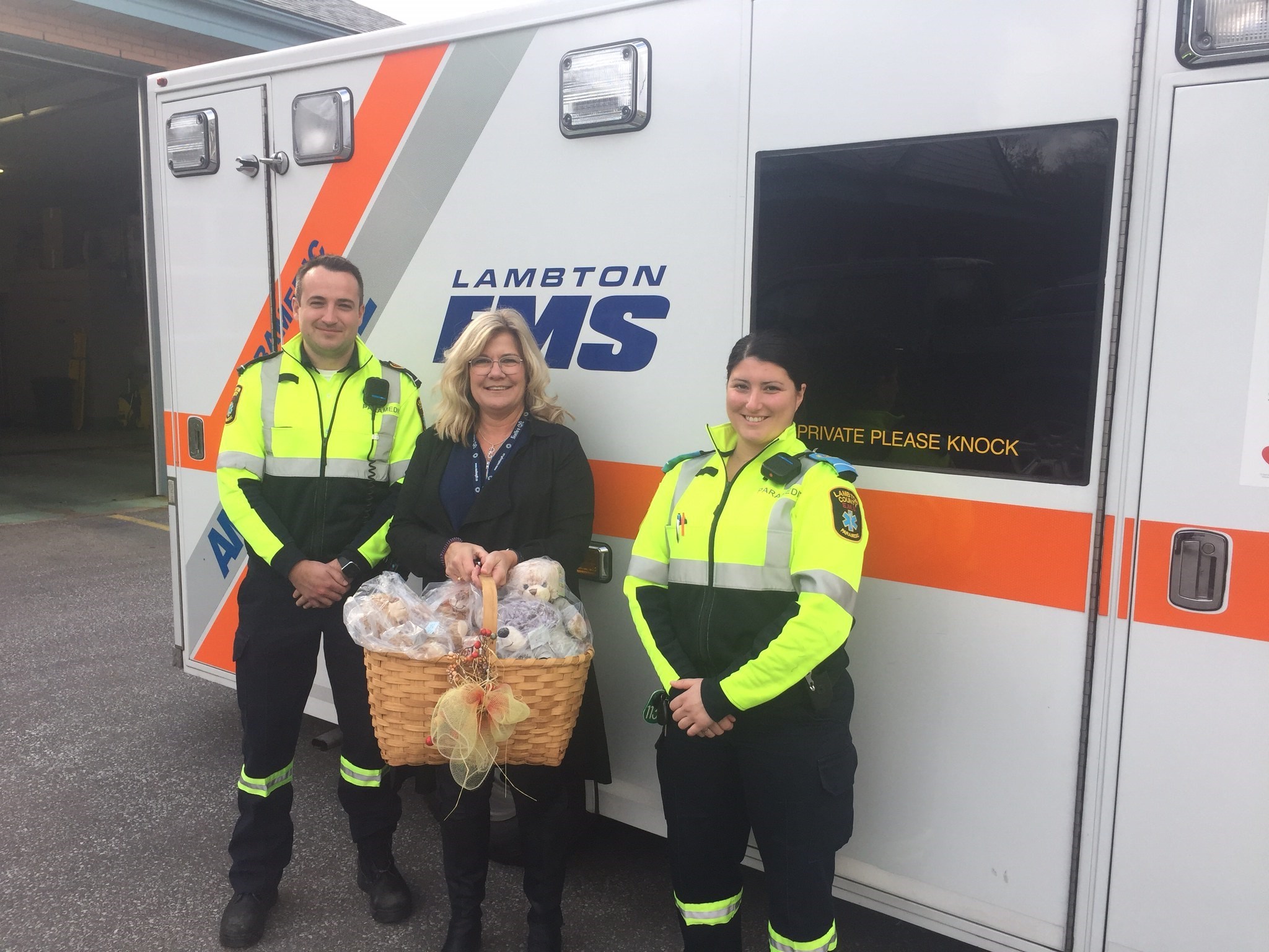 Paramedics presented stuffed bears from Noelle's Gift