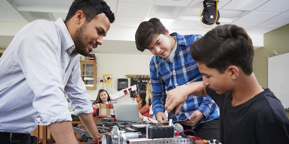 Technology class with students working on robotics