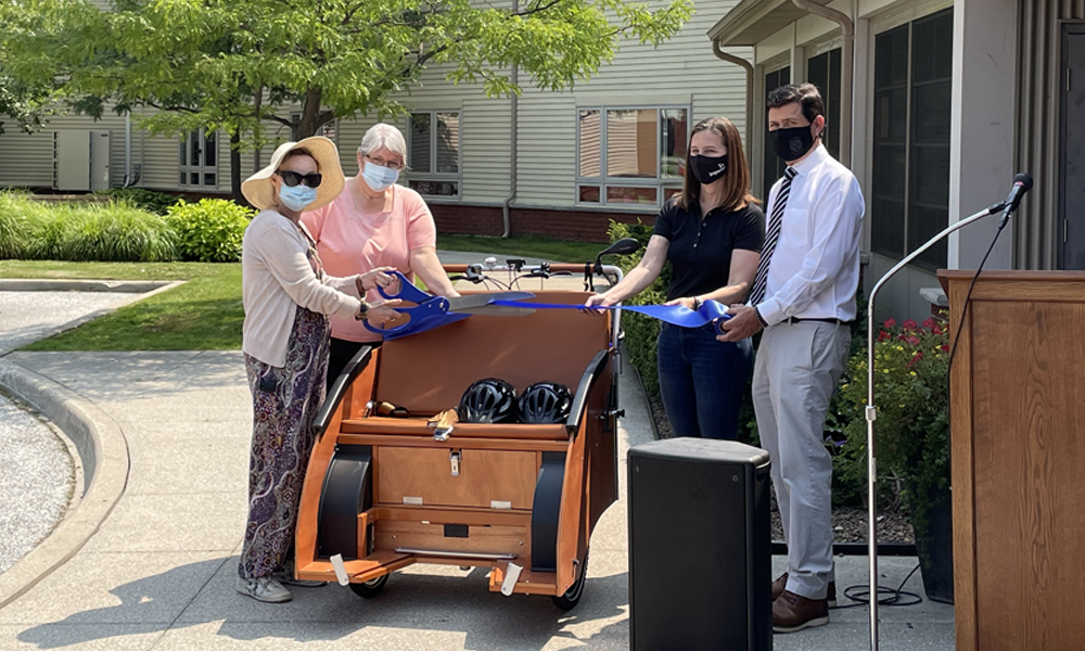 Ribbon cutting ceremony for new trishaw bike at Marshall Gowland Manor