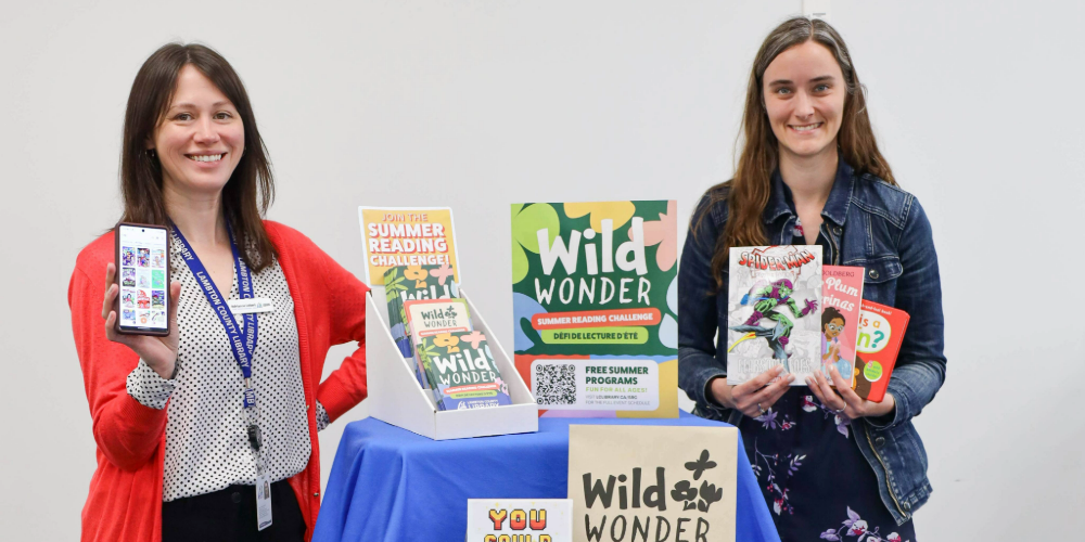 Lambton County Library staff members Adrianne Lebert (left) and Vanitia Campbell showcase materials for Lambton County Library's 