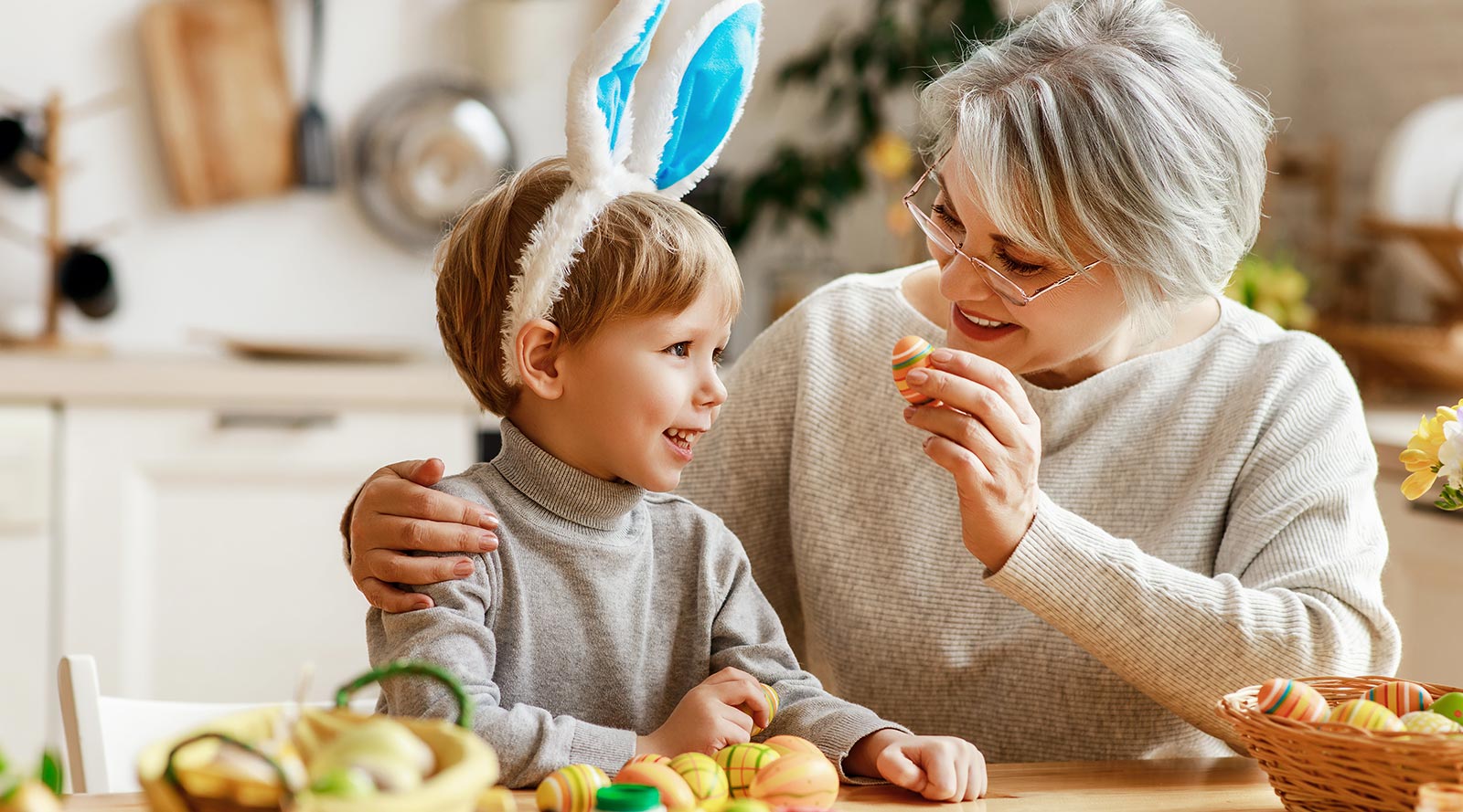 grandmother and child looking at an Easter egg