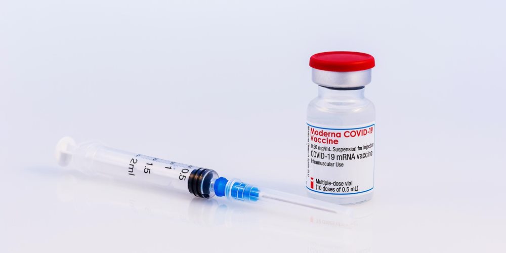 Moderna COVID-19 vaccine vial and syringe