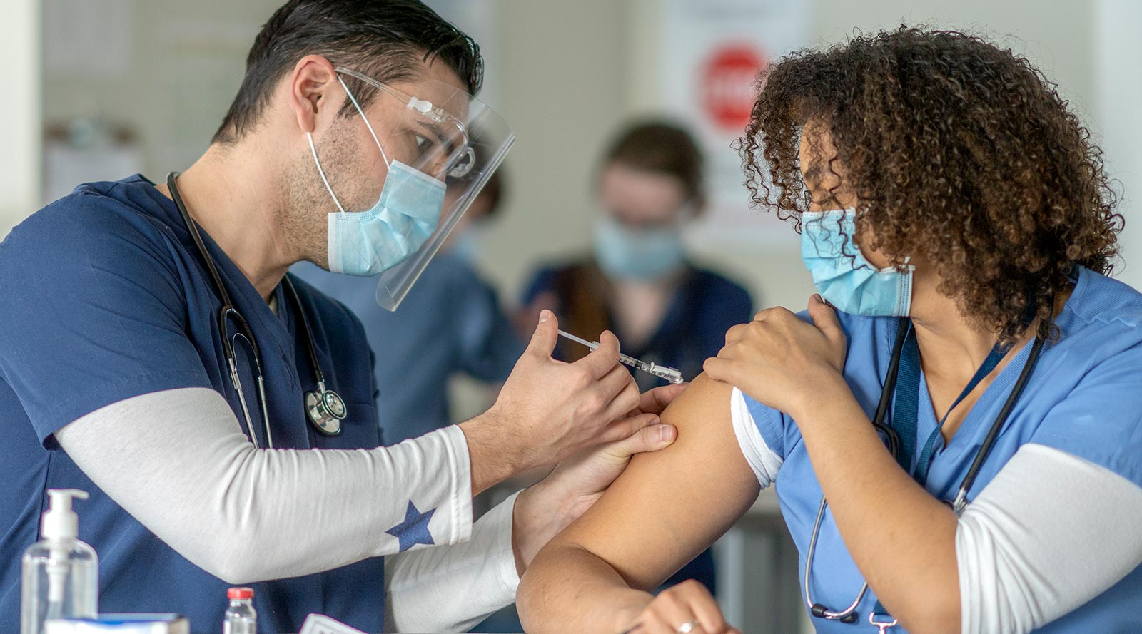 nurse gets vaccine