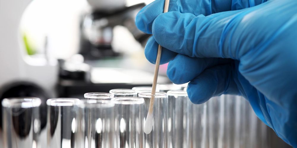 Swab being placed into test tube