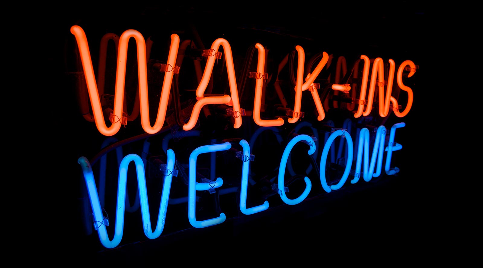 Neon sign saying Walk-ins Welcome