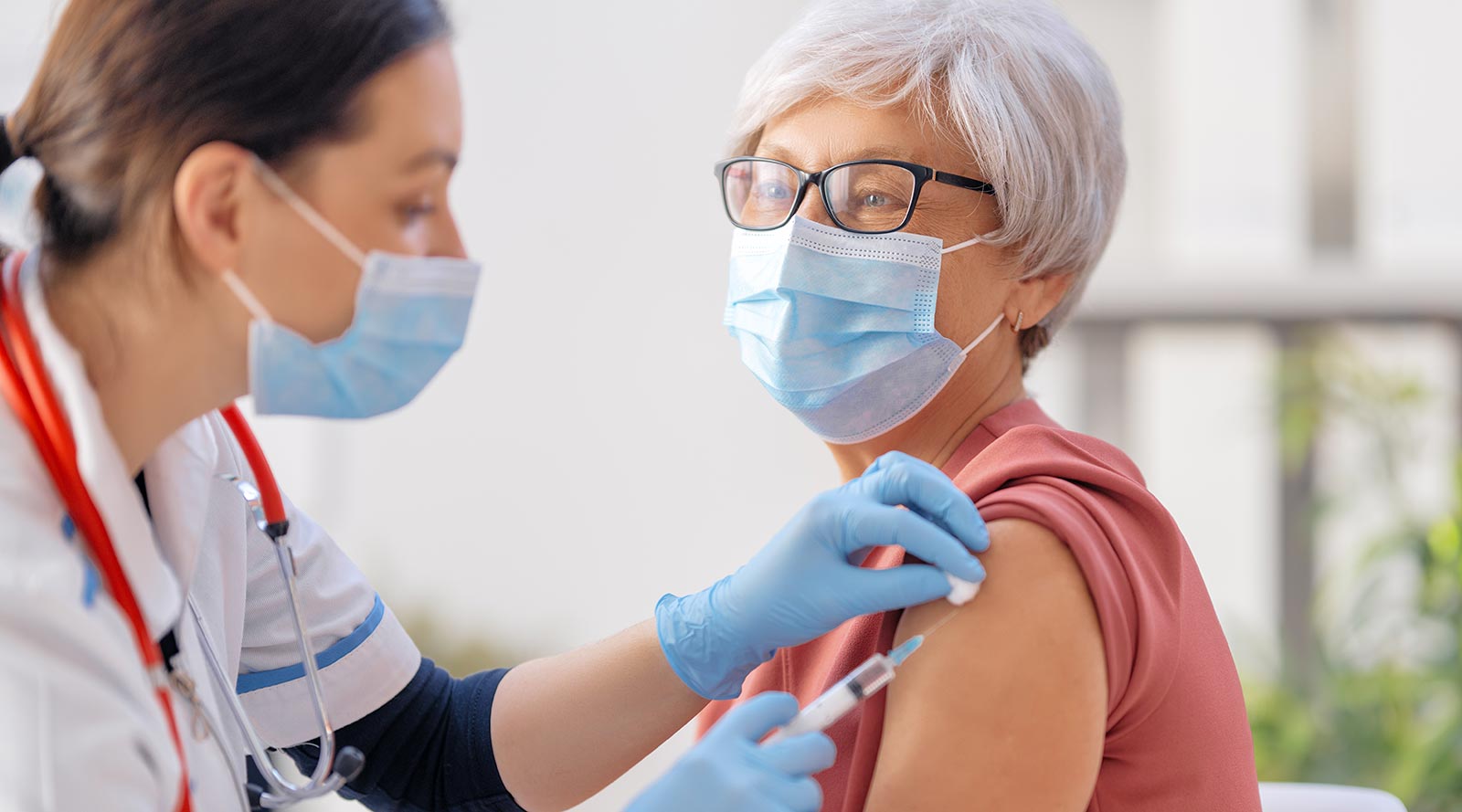 Woman gets COVID 19 vaccine