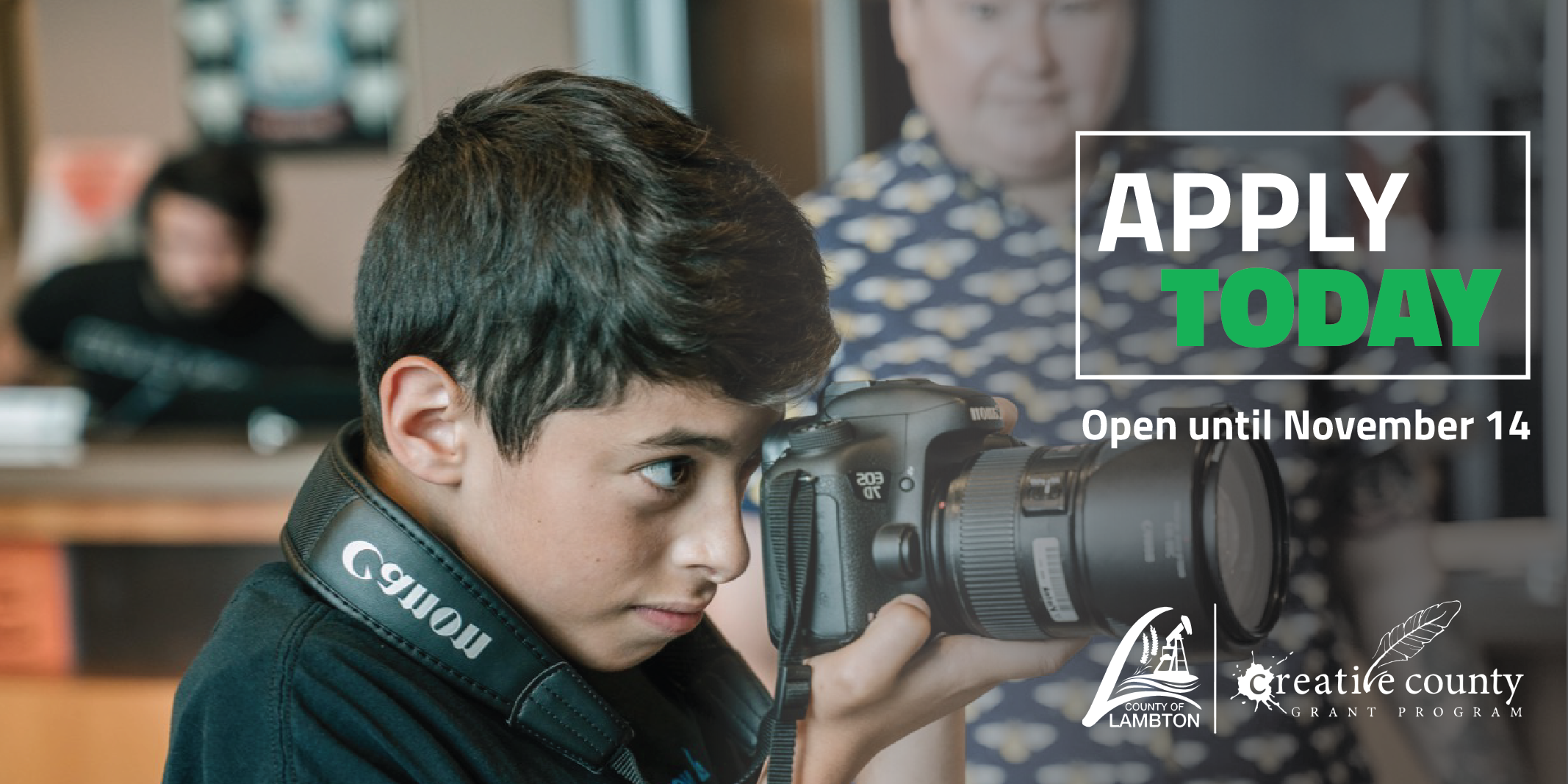 child taking photos with camera